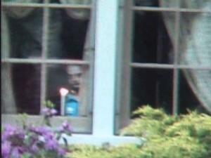 Ghostly face in window of Lu Ann Sicuro