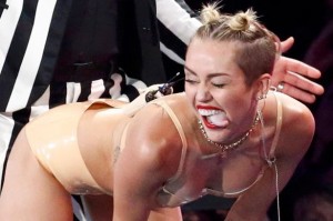 Miley Cyrus sticking out her tongue and twerking